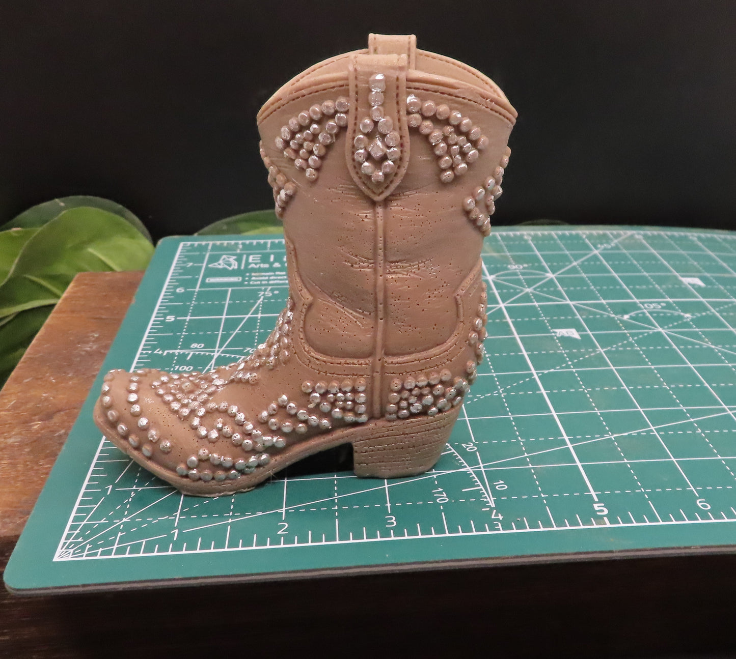 Brown cowboy boot with silver fittings is 4 inches long.