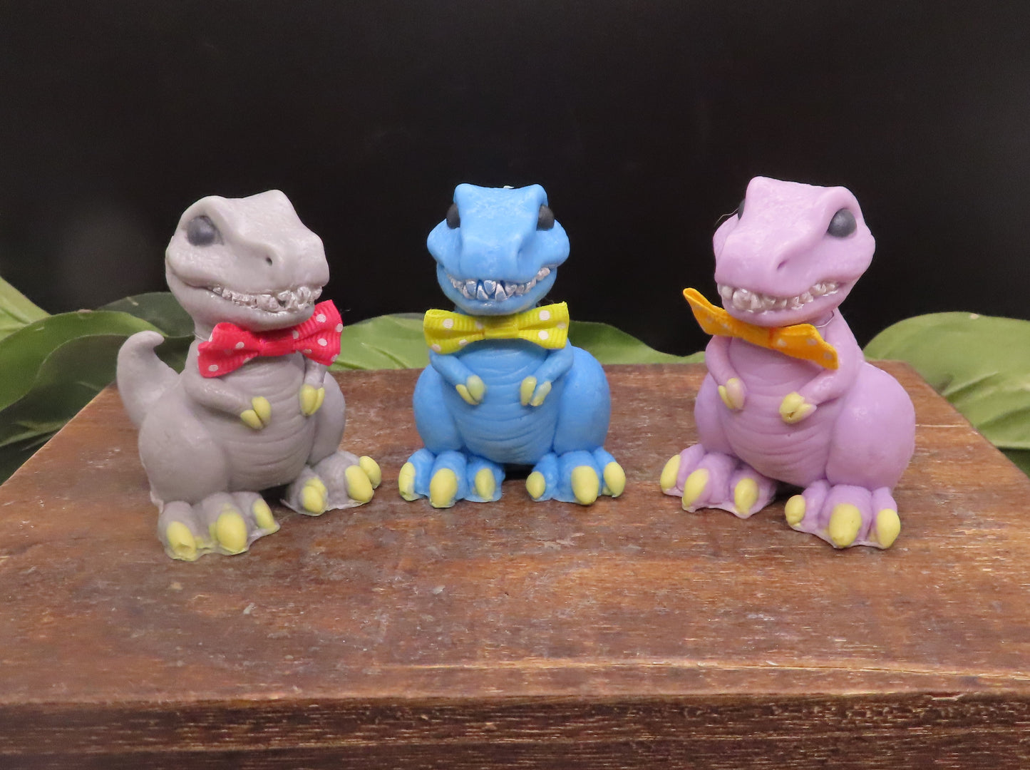 3 different colored T-rex handmade goat milk soaps