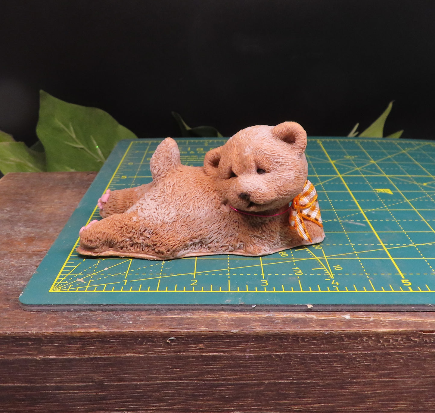 Handmade goat milk soap in the shape of a chow puppy measuring 4 inches long
