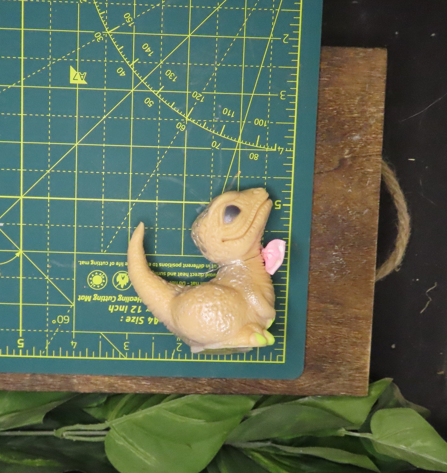 Baby Velociraptor Dinosaur Hand Made Goat Milk Soap measures 3 inches by 2.75 inches.