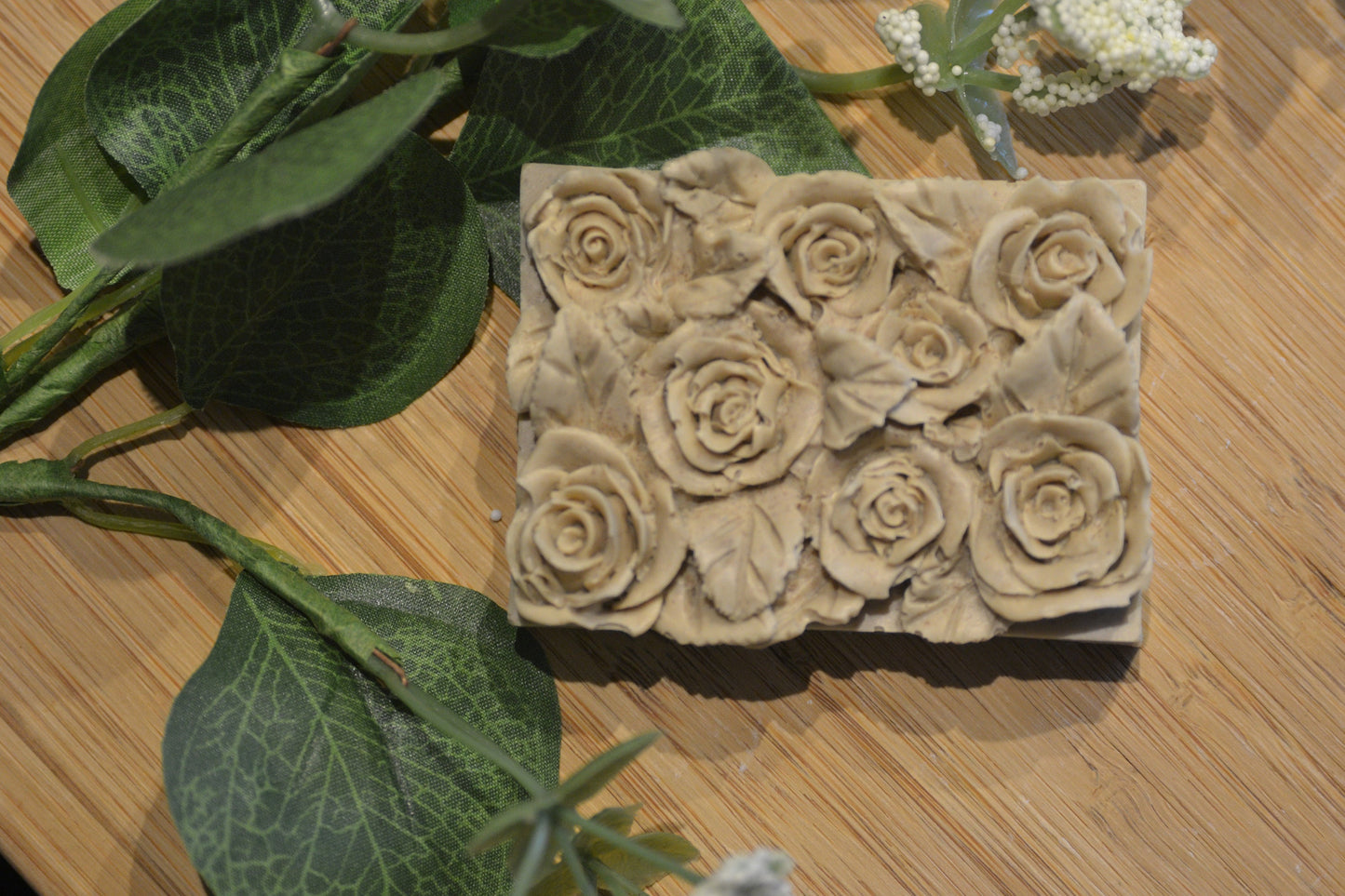 Set of 2 beautifully detailed handmade goat milk soap bars. Image of light brown