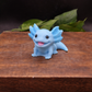 Blue axolotl goat milk soap keepsake gift, individually handcrafted collectible animal soap displayed on a wooden box with natural greenery.