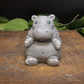 Close up of hippo shaped goat milk soap showing texture and sculpted animal details, decorative keepsake soap