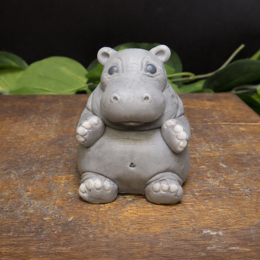 Close up of hippo shaped goat milk soap showing texture and sculpted animal details, decorative keepsake soap