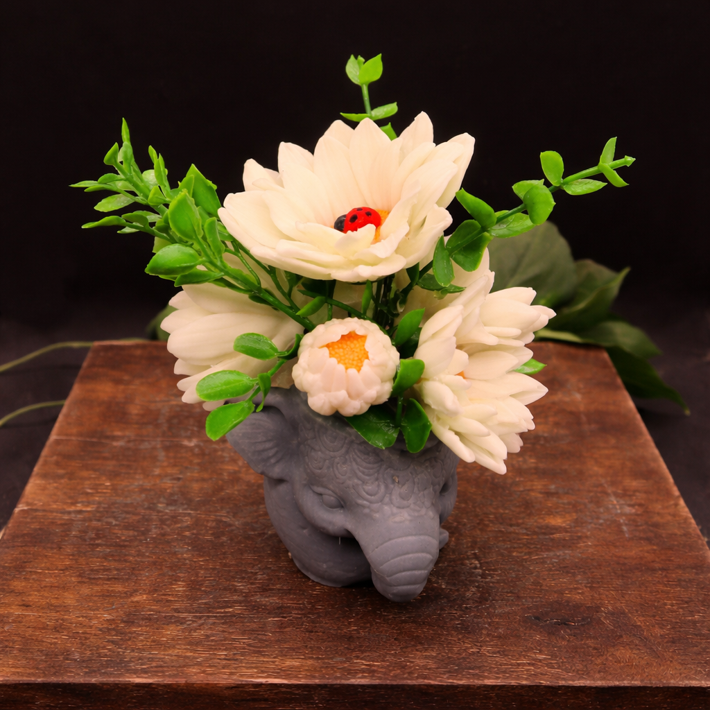 Closup of flowers in daisy garden in elephant pot handmade goat milk soap set unique gift for mom
