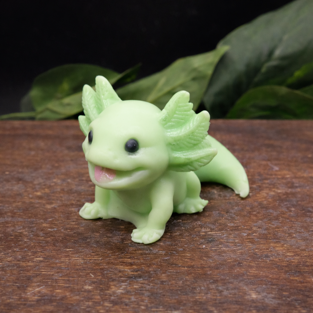 Green axolotl goat milk soap keepsake gift, individually handcrafted collectible animal soap displayed on a wooden box with natural greenery.