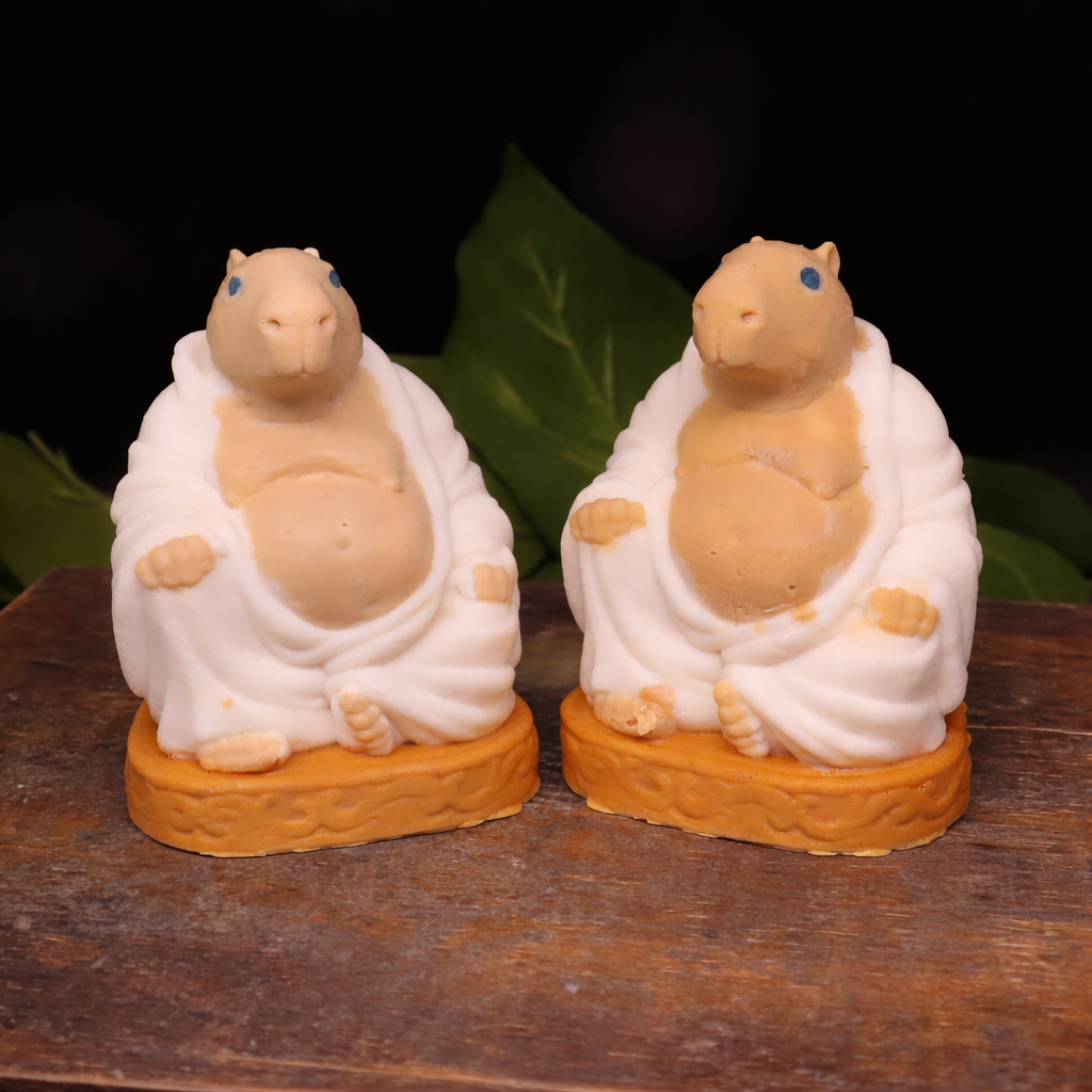  Handmade Goat Milk  Budda Capybara soaps sitting on a wooden  box