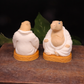 Handmade Goat Milk Budda Capybara soaps sitting on awooden box.  One facing forward, the other  facing backward