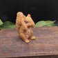 Hear no evil red squirrel goat milk soap with ears covered, handmade animal soap with detailed fur texture and decorative design.
