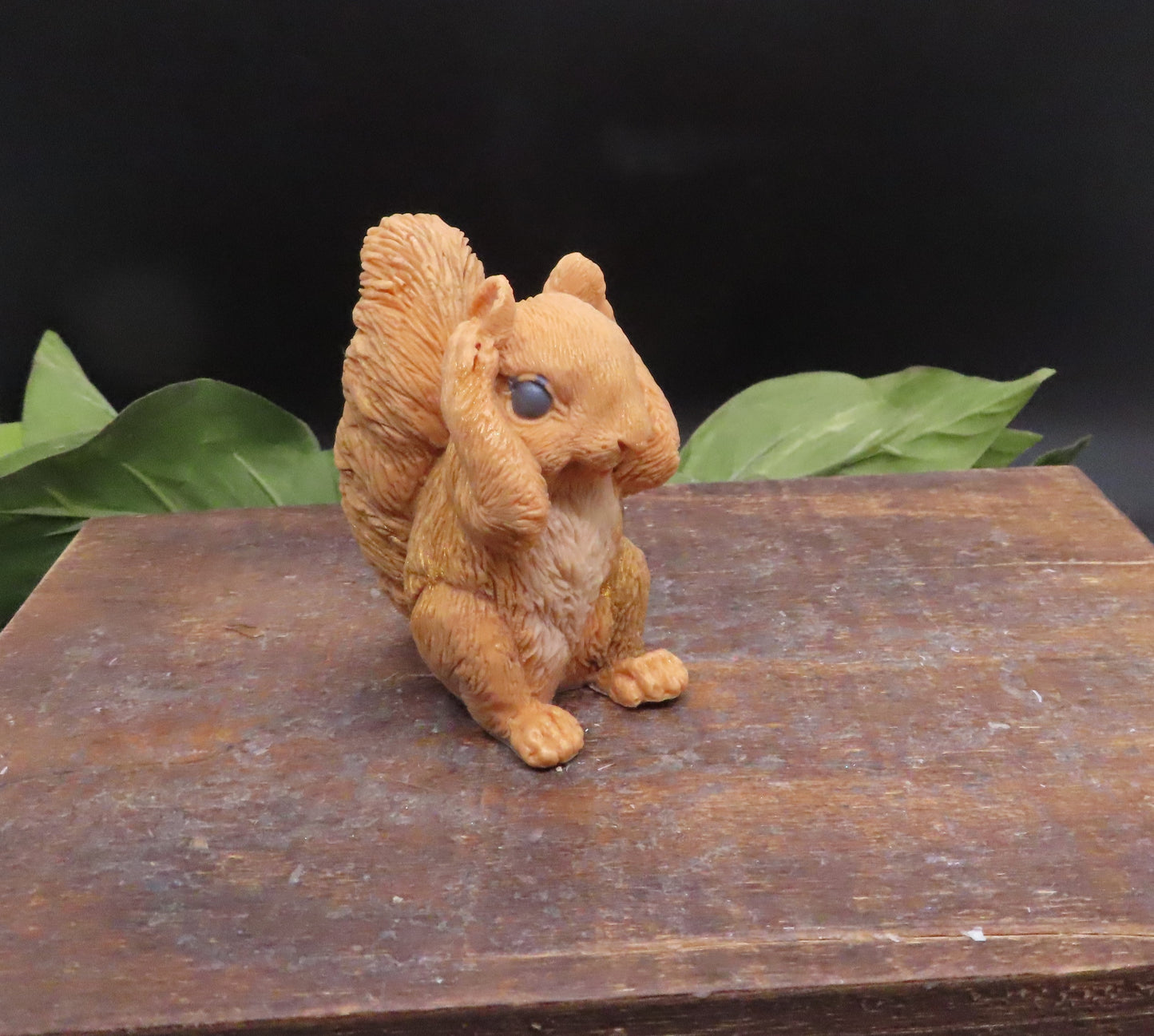 Hear no evil red squirrel goat milk soap with ears covered, handmade animal soap with detailed fur texture and decorative design.