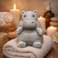 Hippo goat milk soap keepsake displayed on natural surface, cute animal bath soap with soft neutral background and warm lighting