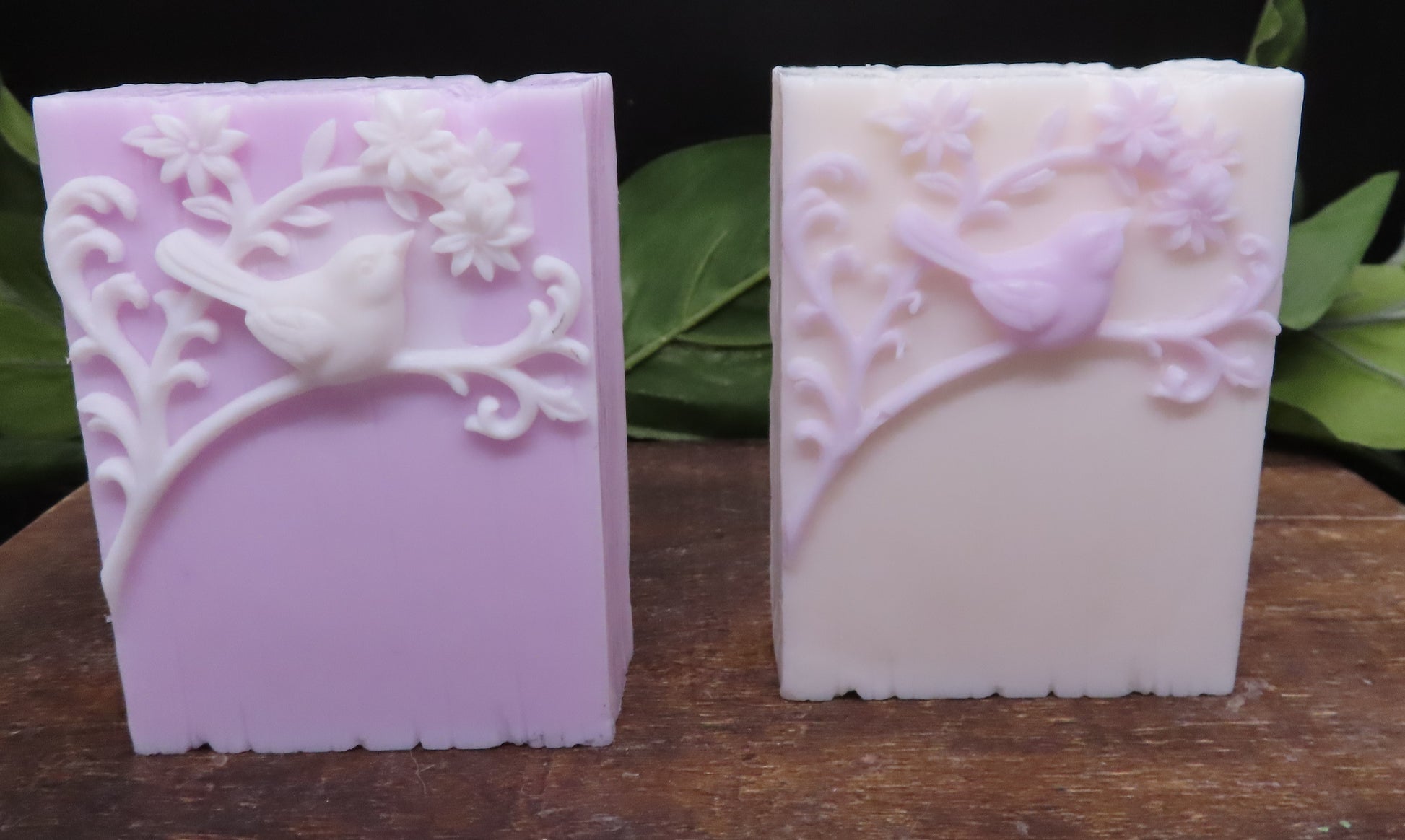 Purple color variations of handmade bird soap bar.  White details on purple bar and purple details on white bar
