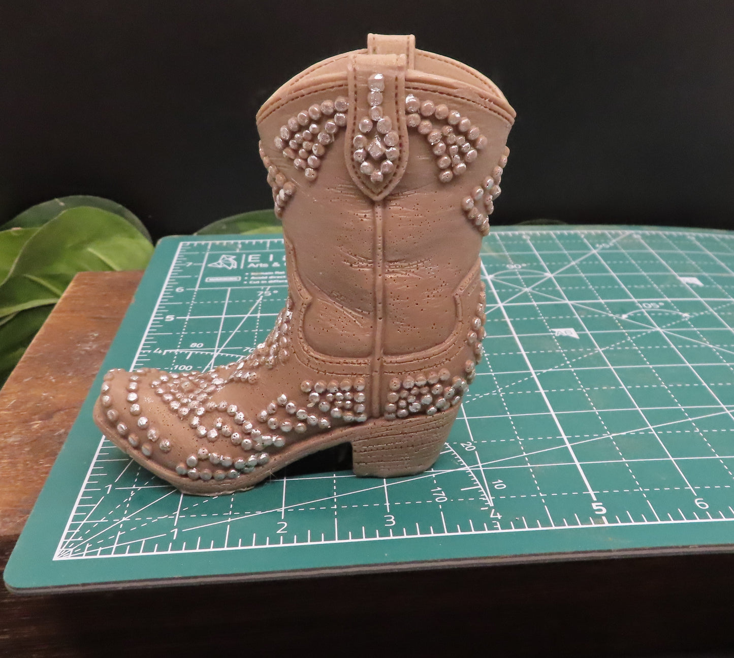 Brown cowboy boot with silver fittings is 4 inches long. 