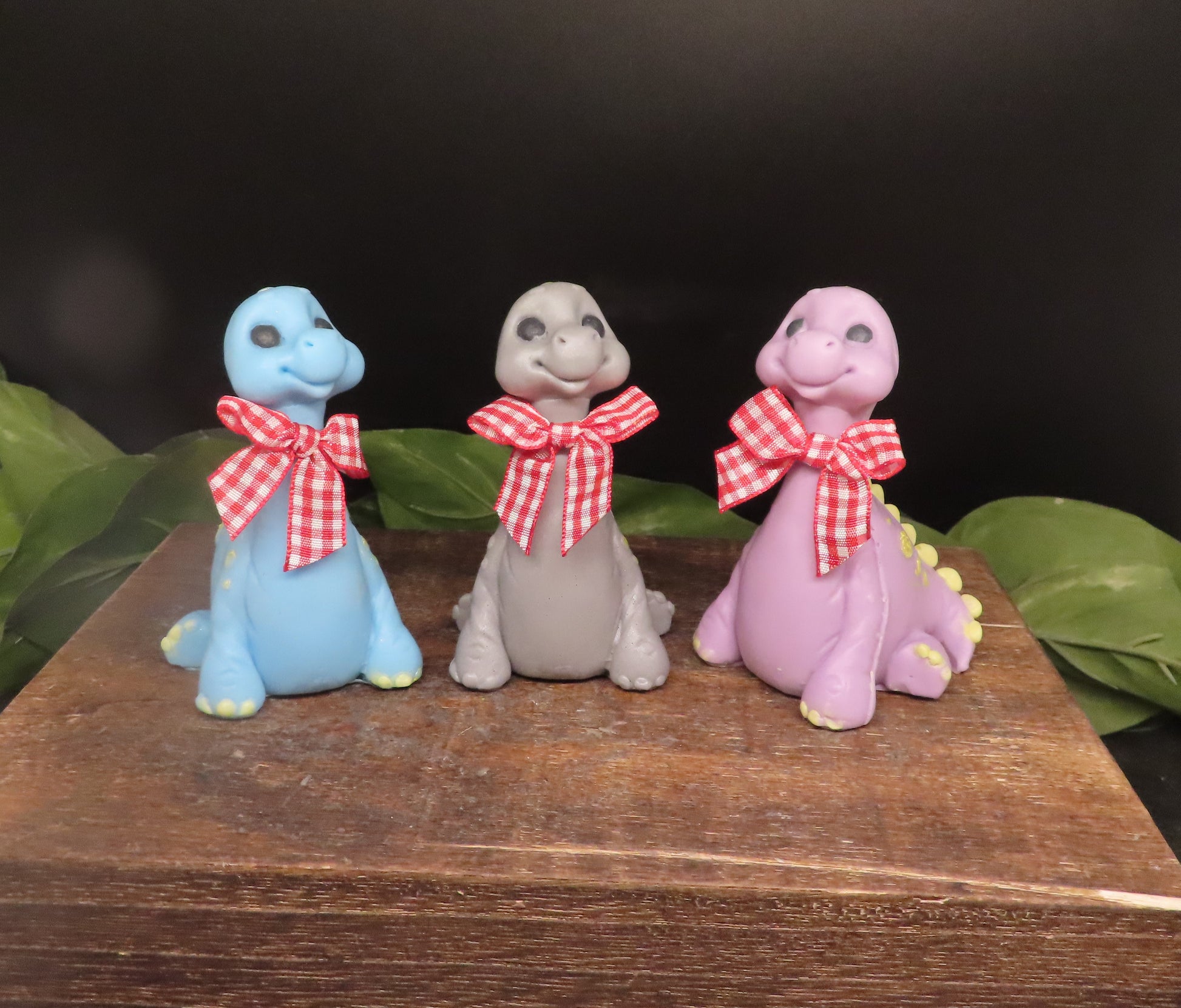 Blue, Gray and Pink examples of adorable brontosaurus goat milk soap