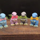A group of mini t-rex goat milk soaps