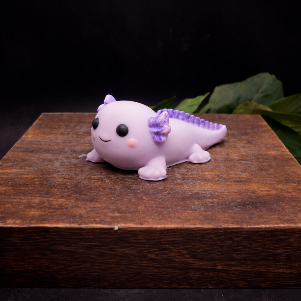 Individually handcrafted purple axolotl goat milk  soap keepsake styled on a rustic wooden block with warm lighting and dark background