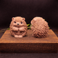 Two large handmade hedgehog goat milk soaps displayed side by side to show scale, sculptural detail, and natural color variation.