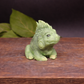 dark green handmade iguana goat milk soap showing detailed scales, facial features, and textured soap against a clean background.r