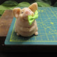 image of handmade pig goat milk soap on cutting mat showing dimension of approximately 1.5 inches wide. 