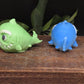 Two colorful shark-shaped  hand soaps 