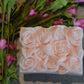 Set of 2 beautifully detailed handmade goat milk soap bars.  Image of pink