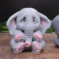 Image of 3 elephants facing different directions