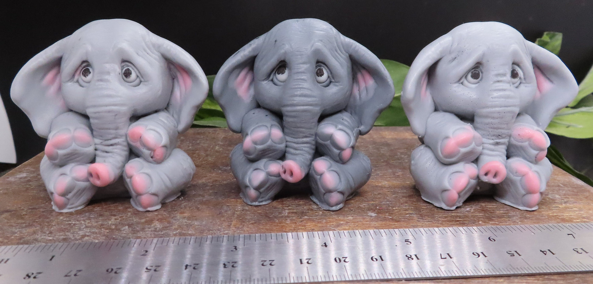 Image of 3 elephant soaps behind a ruler showing width dimention of approximately 2 inches. 