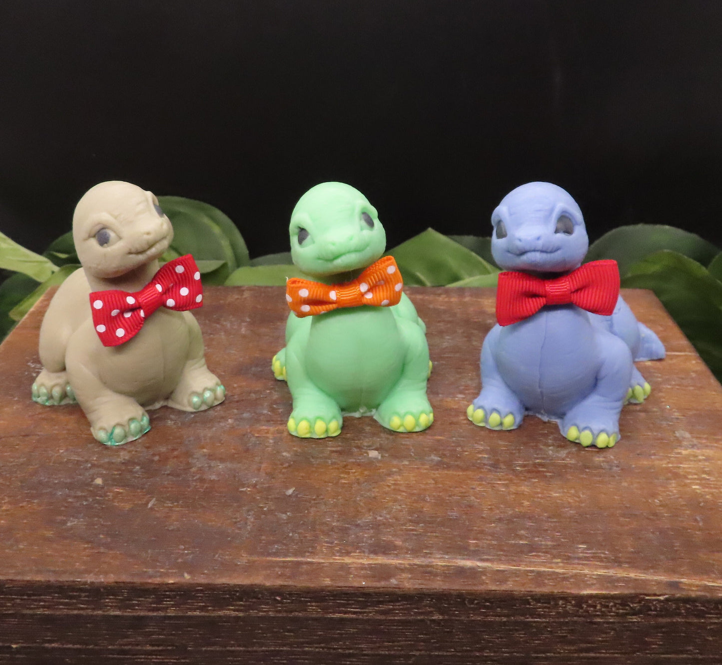 Adorable baby brachiosaurus handmade goat milk soap .  Brown, green and blue versions pictured.  Shown wearing bowties