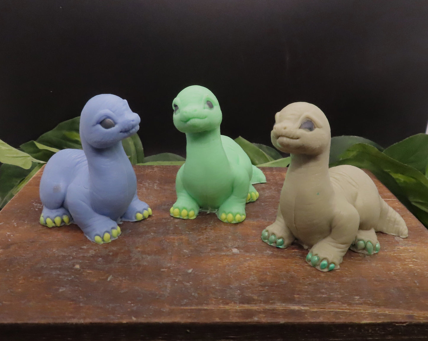 Blue green and brown handmade brachiosaurus soaps shown without bowties